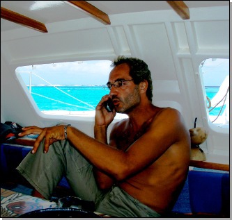 skipper calling inside catamaran from the Tobago Cays